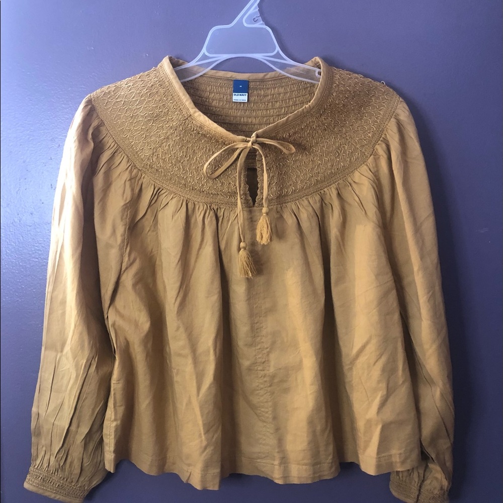 Women’s gold blouse